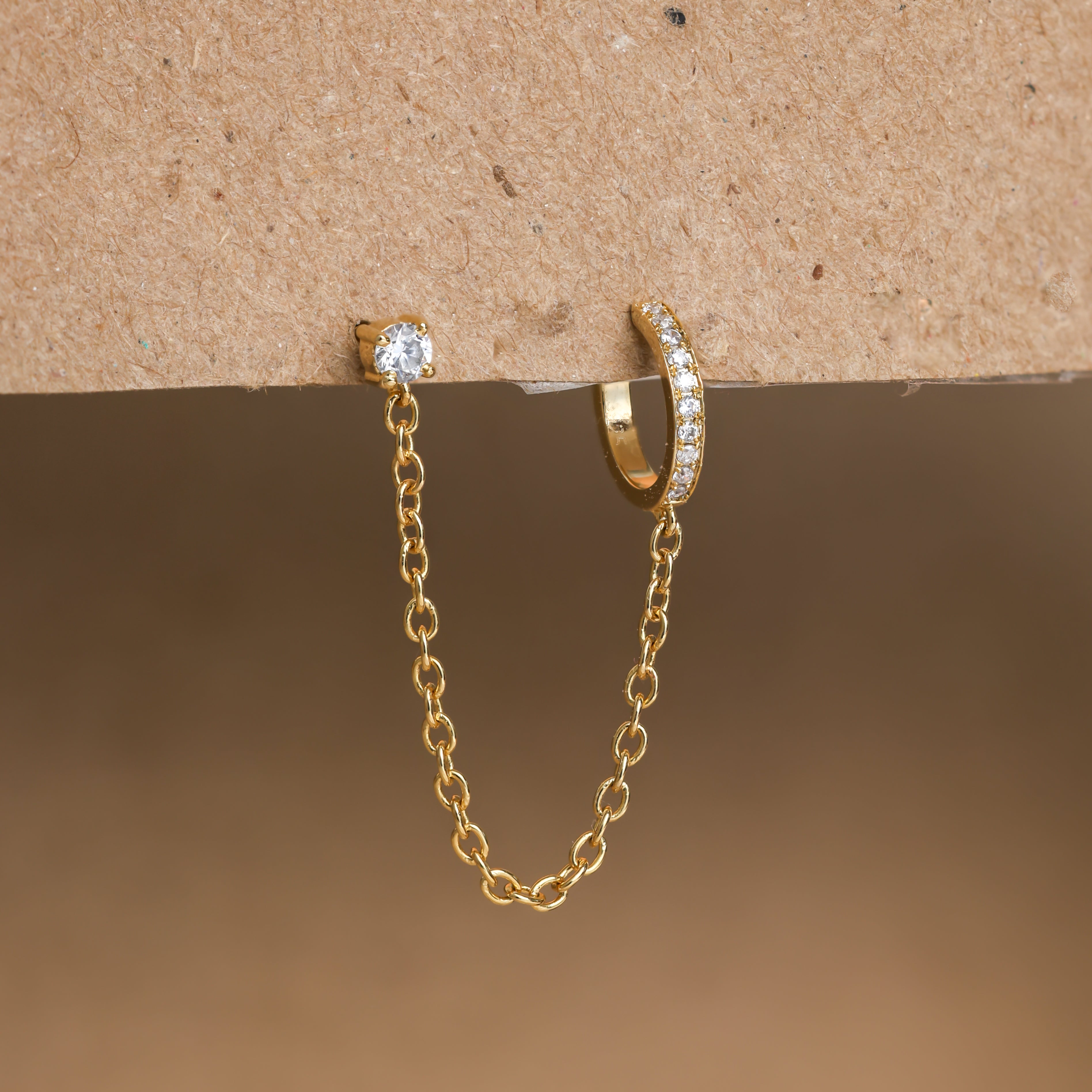 Elegant ear cuff featuring a pave-set chain design